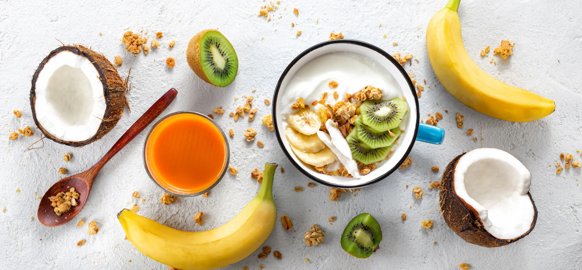 Coconut yogurt bowl with granola and fresh fruit showing a healthy meal that can be high in calories
