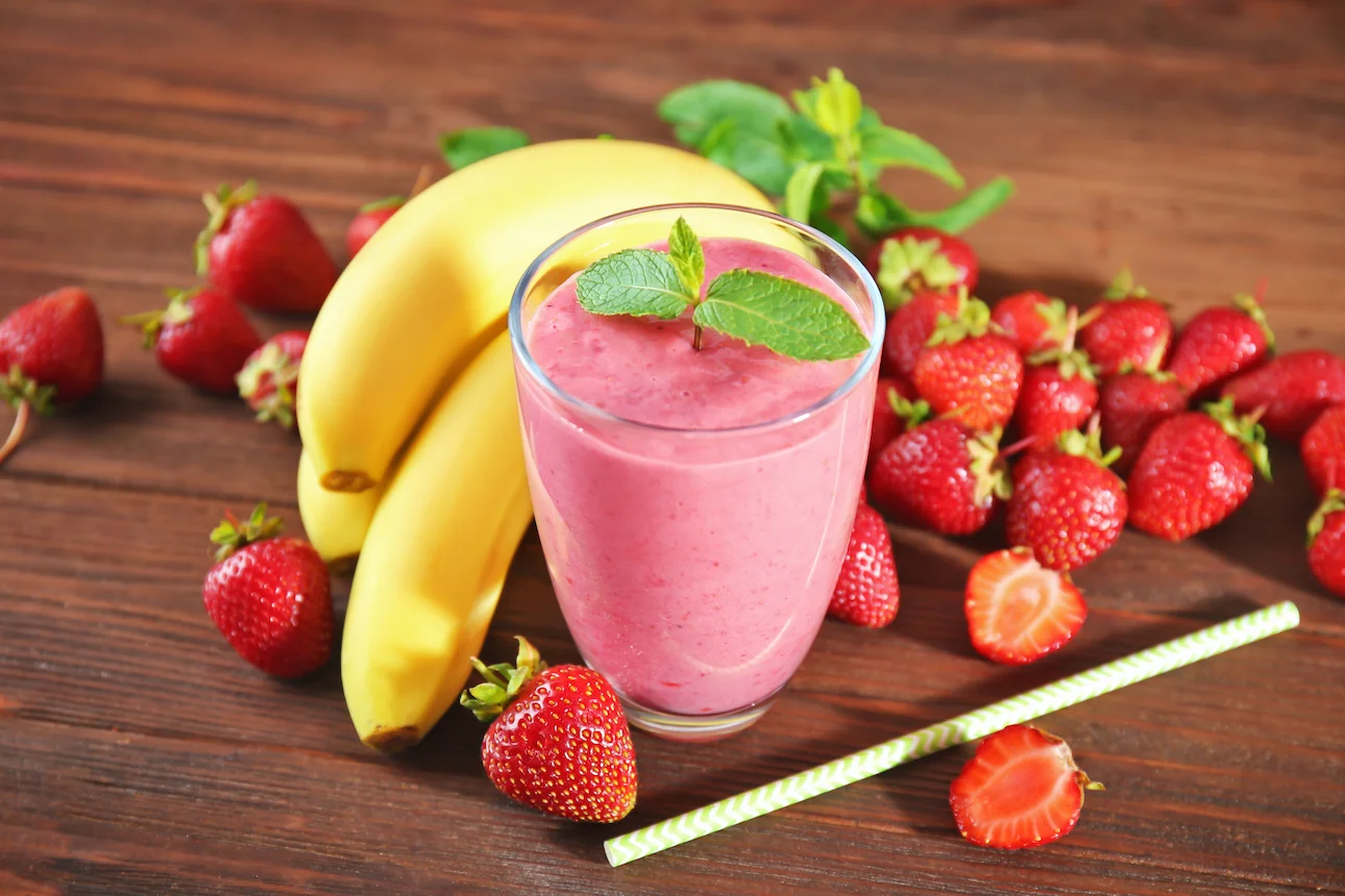 Strawberry banana smoothie in a glass highlighting a healthy drink that can contain hidden calories